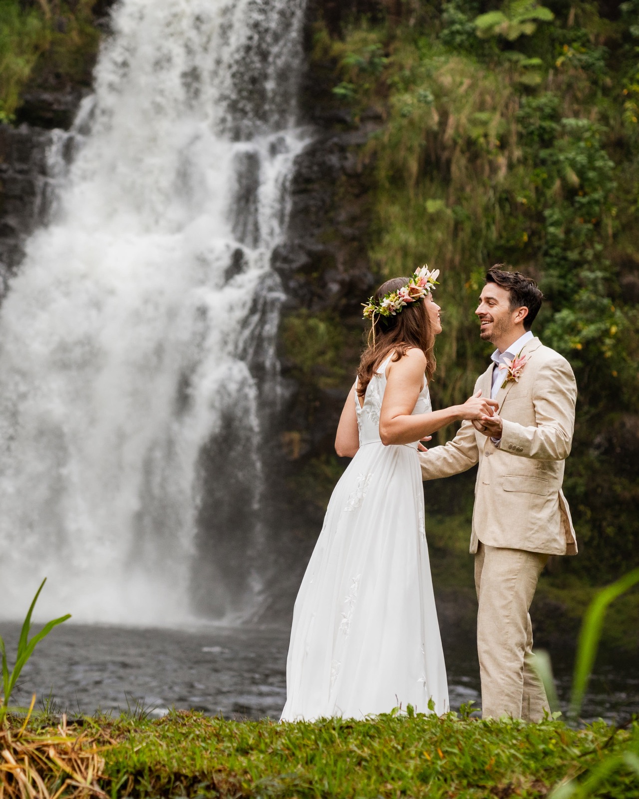 Bride and groom at a waterfall - Santillan Jewelers